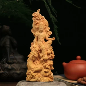 Front view of Chenglong Zizai Guanyin seated above a coiled dragon in golden boxwood
