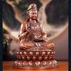 Copper Willow Guanyin on a tiered lotus pedestal, holding a willow sprig and a tilted vase