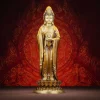 Front view of brass Dharma Wheel Guanyin in antique tea-gold, standing on a lotus and holding a small wheel