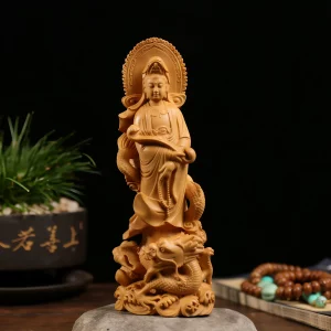 Front view of a warm golden boxwood Dragon Guanyin statue holding a ruyi scepter above a coiled dragon and waves