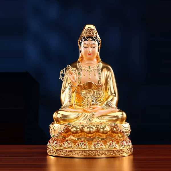 Gilded brass Willow Guanyin with a painted face, willow branch and vase on a lotus throne