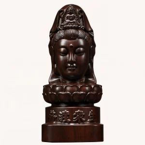 Front of a dark wood Guanyin head statue on a lotus pedestal and inscribed round base