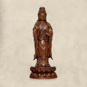 Front of a large standing copper Guanyin with a willow branch, tilted water vase and double lotus base