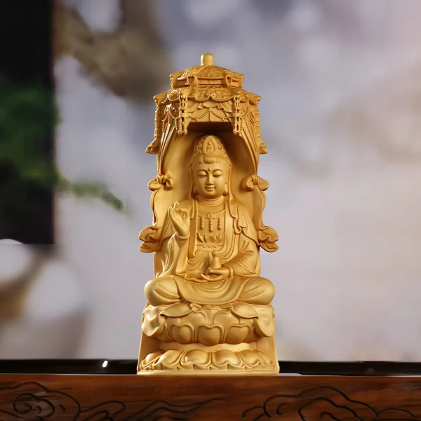 Front view of an 18 cm Huangyang wood Guanyin seated beneath an ornate pagoda canopy