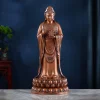 Front view of the 47.5 cm copper Putuo Guanyin, holding a Dharma wheel above a layered lotus pedestal