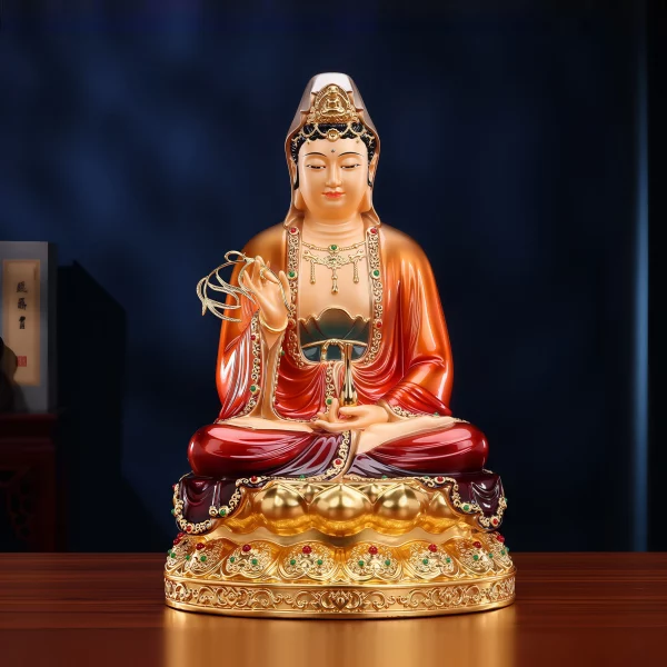 Front view of the 39 cm brass Willow Guanyin, with red robes, a gold-toned lotus pedestal, willow sprig and narrow water vase