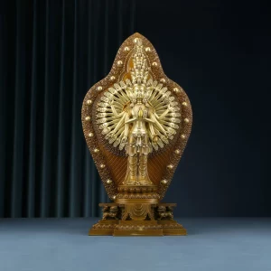 Front of the Thousand-Armed Guanyin in antique gold-colored brass, with radiating hands and a tall ornamental backplate