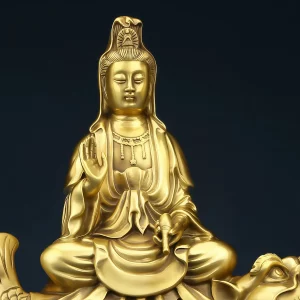 Close view of Aoyu Kuan Yin showing the headdress, raised hand, draped robes and water vessel Close view of Aoyu Kuan Yin showing the headdress, raised hand, draped robes and water vessel