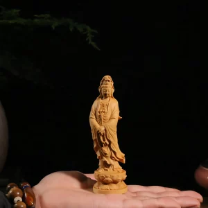 12 cm boxwood Nazhu Guanyin resting on an open hand, with a small carved loop of prayer beads