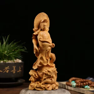 Dragon Guanyin Statue — Three-quarter view Three-quarter view of boxwood Kuan Yin showing the curved ruyi scepter, flowing robe and dragon base