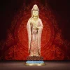 Falun Guanyin with coral-patterned robes, gold-colored face and hands, and a blue base beneath the red lotus