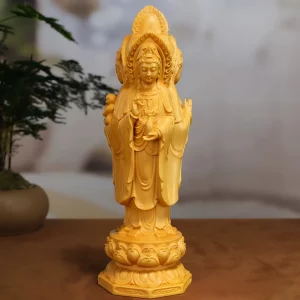 Nanhai Kuan Yin viewed from the side holding a slender water vase Nanhai Kuan Yin viewed from the side holding a slender water vase