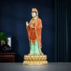Three-quarter view of the 38 cm Putuo Kuan Yin with a raised palm and a small wheel