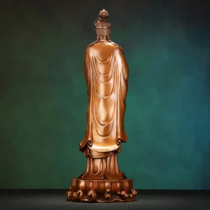 Copper Kuan Yin — Back View Back view of the standing copper Kuan Yin showing long robe folds above the lotus and curling waves
