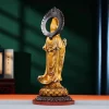 Rear view of the antique tea-gold Kuan Yin, showing the dark reverse of the halo and flowing robes