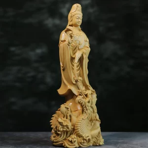 Boxwood Dragon Guanyin with a Pouring Vase — Natural Three-quarter View Three-quarter view of the natural-finish Dragon Guanyin with a carved stream and curling dragon