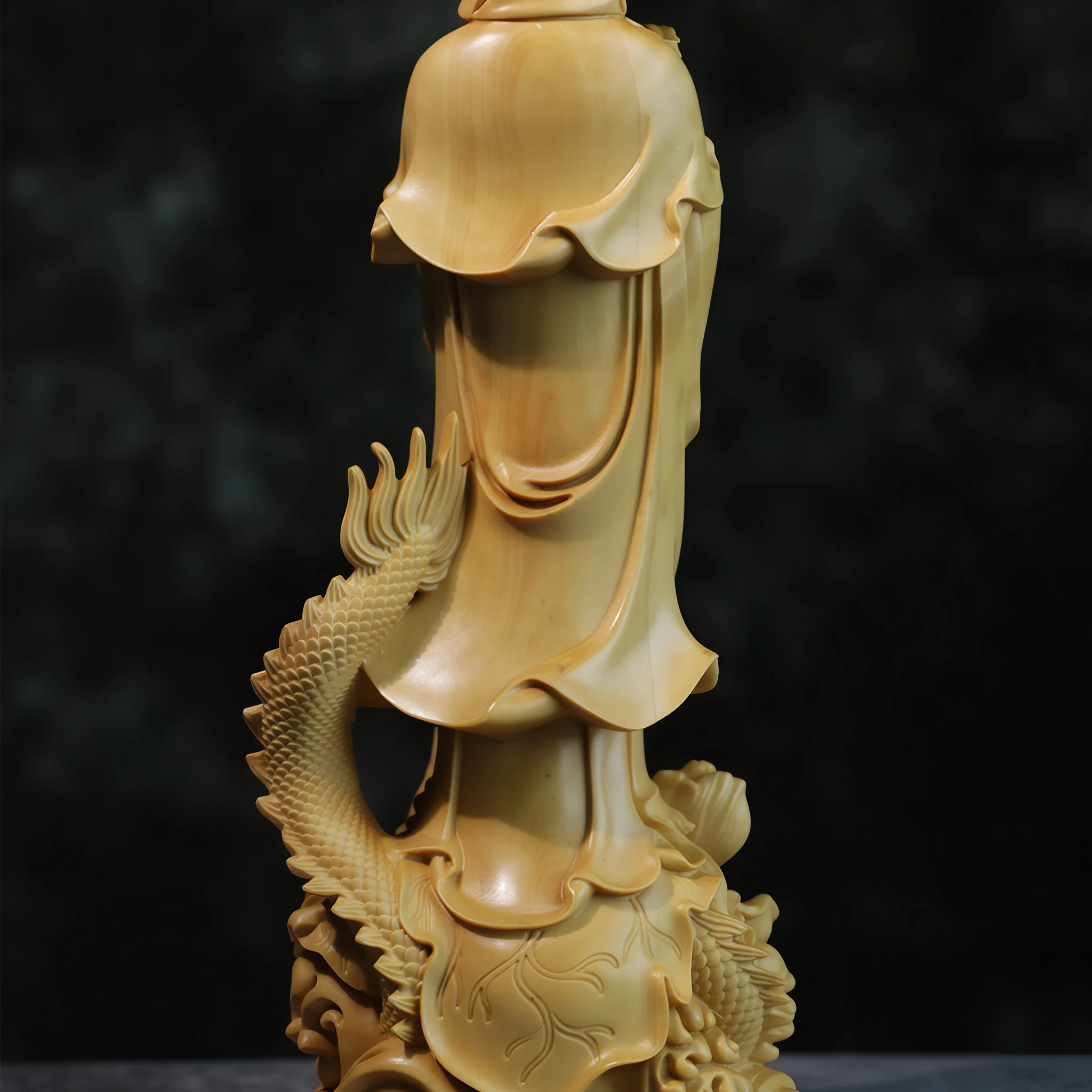 Back detail of the boxwood Guanyin robe and the dragon rising behind it
