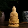 Rear of the natural boxwood Guanyin, with flowing robe folds and the two-layer lotus pedestal