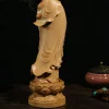 Rear detail of the boxwood Guanyin showing flowing robe folds, wood grain and the lotus pedestal