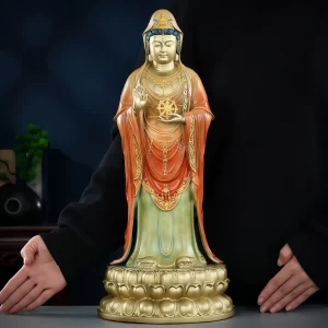 Front view of the 48 cm Putuo Guanyin with a gold-tone hood and chest, red robe and muted green lower robe