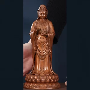 The 22 cm copper Putuo Guanyin with a raised palm, Dharma wheel and lotus pedestal