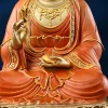 Detail of Zuolian Guanyin holding a leafy sprig in the right hand and a tilted vase in the left