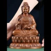 The 22.5 cm copper Willow Guanyin with its compact layered lotus pedestal; the original person provides a visual scale reference