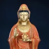 Detail of the 38 cm Putuo Kuan Yin showing the face, crown, raised palm and Dharma wheel