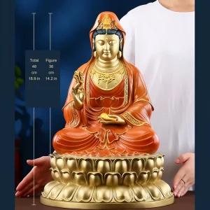 The 48 cm painted brass Guanyin statue with red robes and a gold-colored lotus seat, beside the original person