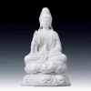 White porcelain Bajiaozuo Guanyin statue holding a vase and sprig, seated on a lotus above an octagonal pedestal
