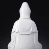 Rear detail of Bajiaozuo Guanyin showing the smooth white porcelain hood and layered robe folds