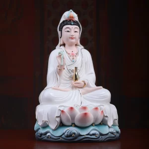 Baoxiang Guanyin — White and Gold Accents — Three-quarter view Three-quarter view of the Baoxiang Kuan Yin statue, showing the raised hand, gold-tone vase and layered white robes above the lotus base