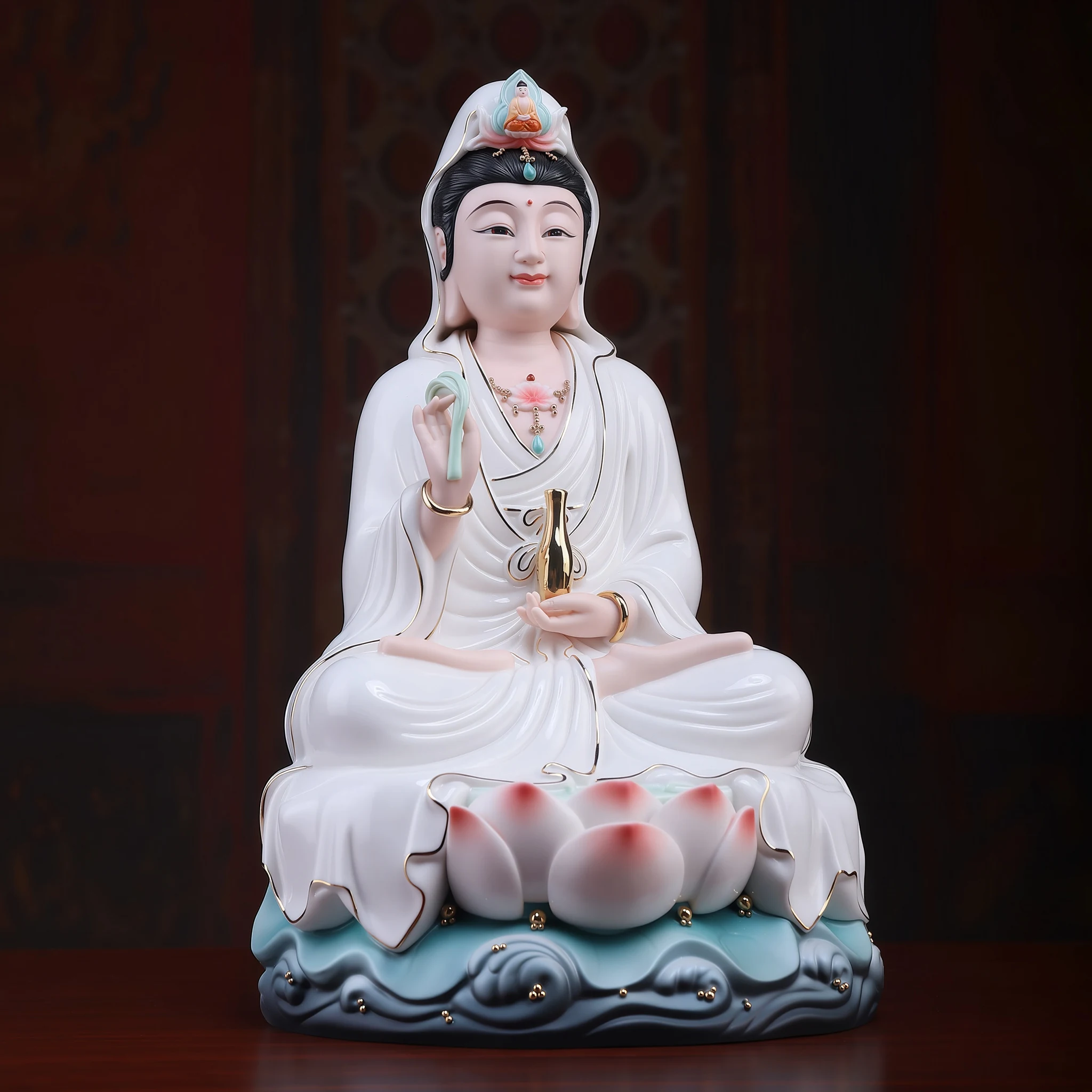 Three-quarter view of the Baoxiang Kuan Yin statue, showing the raised hand, gold-tone vase and layered white robes above the lotus base
