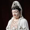 Painted Kuan Yin face and crown with black hair, a red forehead dot and delicate gold-colored trim