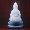 Rear of Cilian Guanyin showing the white veil, folded robe, teal lotus leaves and blue wave base