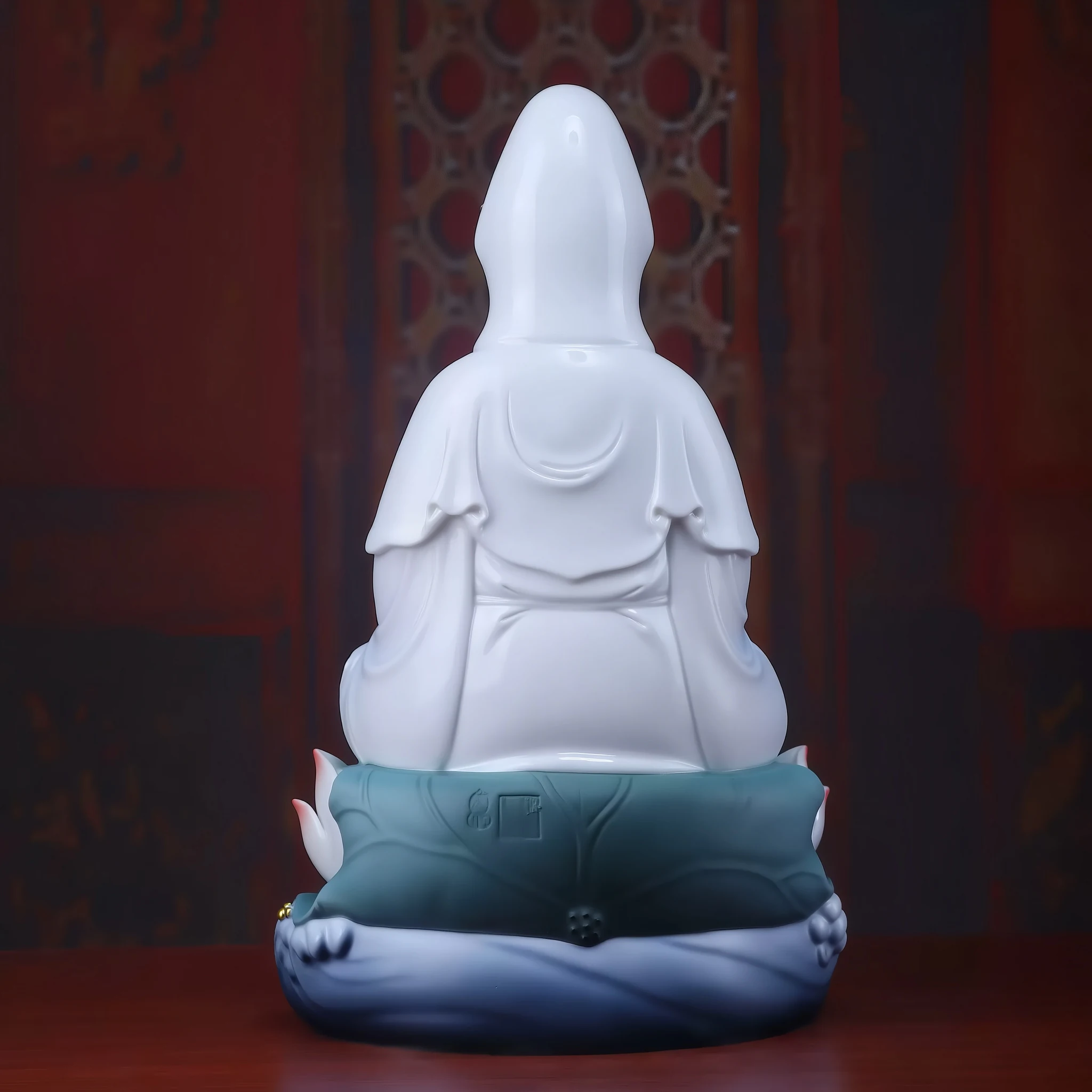Rear of Cilian Guanyin showing the white veil, folded robe, teal lotus leaves and blue wave base