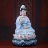 Three-quarter view of the blue-robed Cilian Kuan Yin statue, with a white veil and layered pink lotus seat