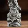 Lotus petals, feet and curling-wave relief on the base of the small Duhai Guanyin statue
