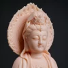 Close view of the face, small seated figure in the crown and flame-shaped halo of the peach pink Foguang Guanyin statue