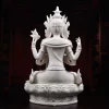 Rear view showing the headdress ties, four arms and draped robes of the white porcelain Guanyin