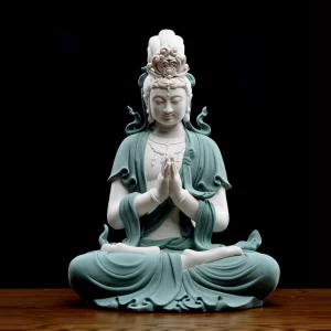 Front view of the 48 cm (18.9 in) teal Hezhang Guanyin statue, seated with joined palms beneath a tall ornamental crown