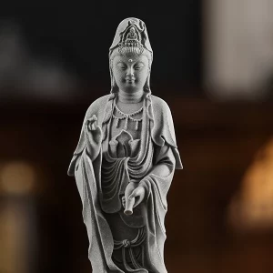 Jingping Guanyin Statue — Crown, raised hand and water vase · frontal detail Jingping Kuan Yin detail showing the veiled crown, lowered eyes, raised hand and tilted water vase