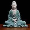Front view of the 29.5 cm (11.6 in) Jingsi Guanyin statue in teal and white, with prayer beads resting in the lap above flowing robes