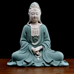 Front view of the 29.5 cm (11.6 in) Jingsi Guanyin statue in teal and white, with prayer beads resting in the lap above flowing robes