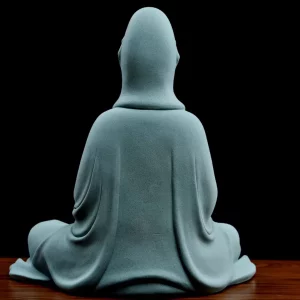 Back of the teal Jingsi Kuan Yin statue, showing the hood, long robe folds and a faint impressed mark