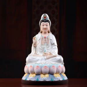 Front view of Linghui Guanyin holding a willow and floral vase, with pearly white robes above a pink-tipped lotus seat
