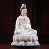 Three-quarter view of Linghui Guanyin showing the raised willow, crossed legs and rounded pastel lotus pedestal