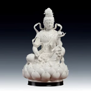 Front view of the white porcelain Lotus Ribbon Guanyin statue, holding a lotus above a layered lotus seat, on a black display stand