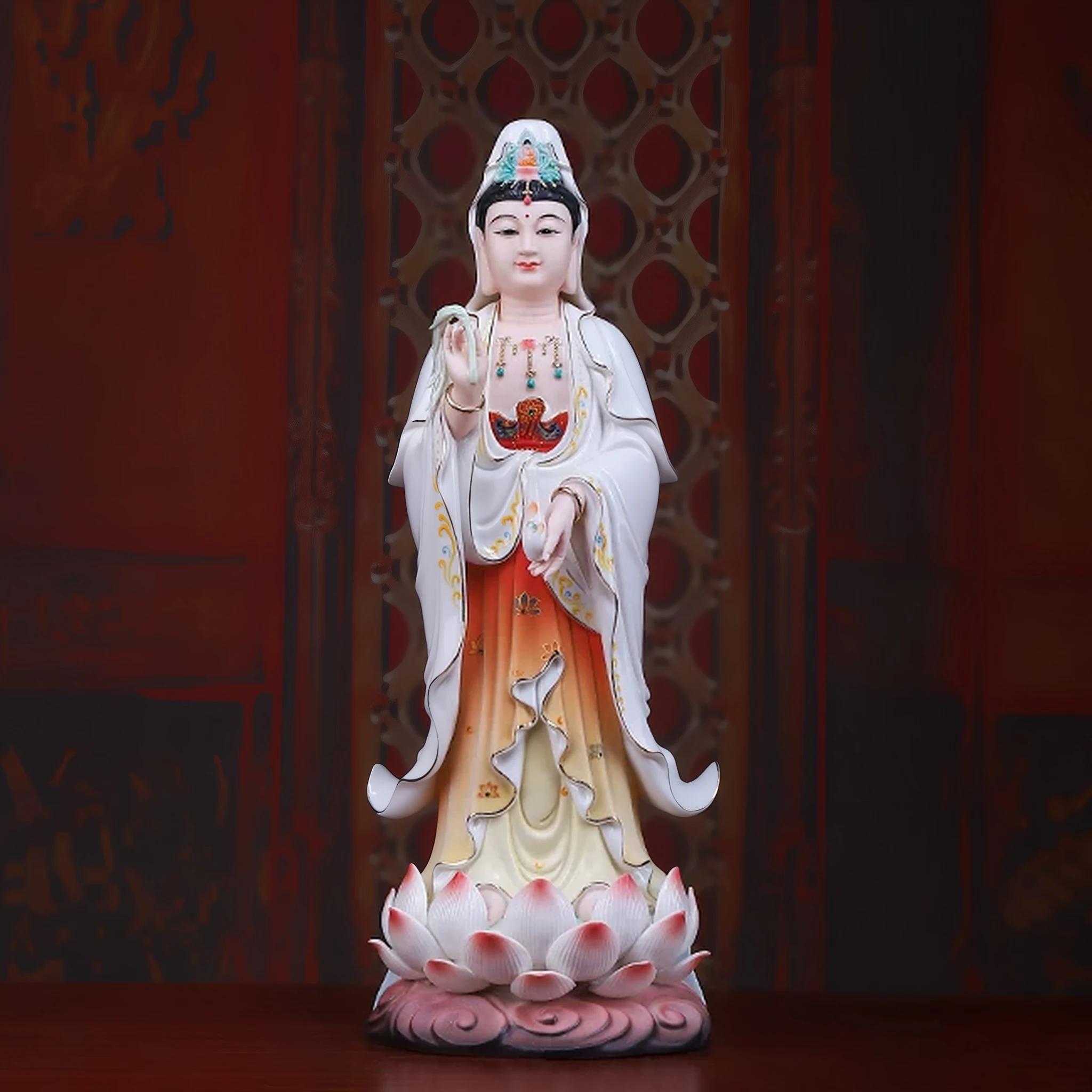 Painted porcelain standing Guanyin statue, 36 cm (14.2 in), with white and amber robes on a pink lotus base