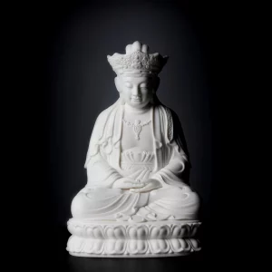 Full figure with an ornate crown, resting hands and double lotus seat on the 22 cm (8.7 in) Pilu Guanyin statue in white porcelain
